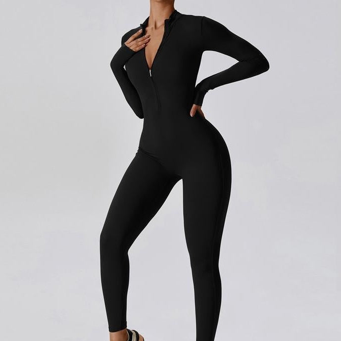 Person wearing a black jumpsuit on a white background