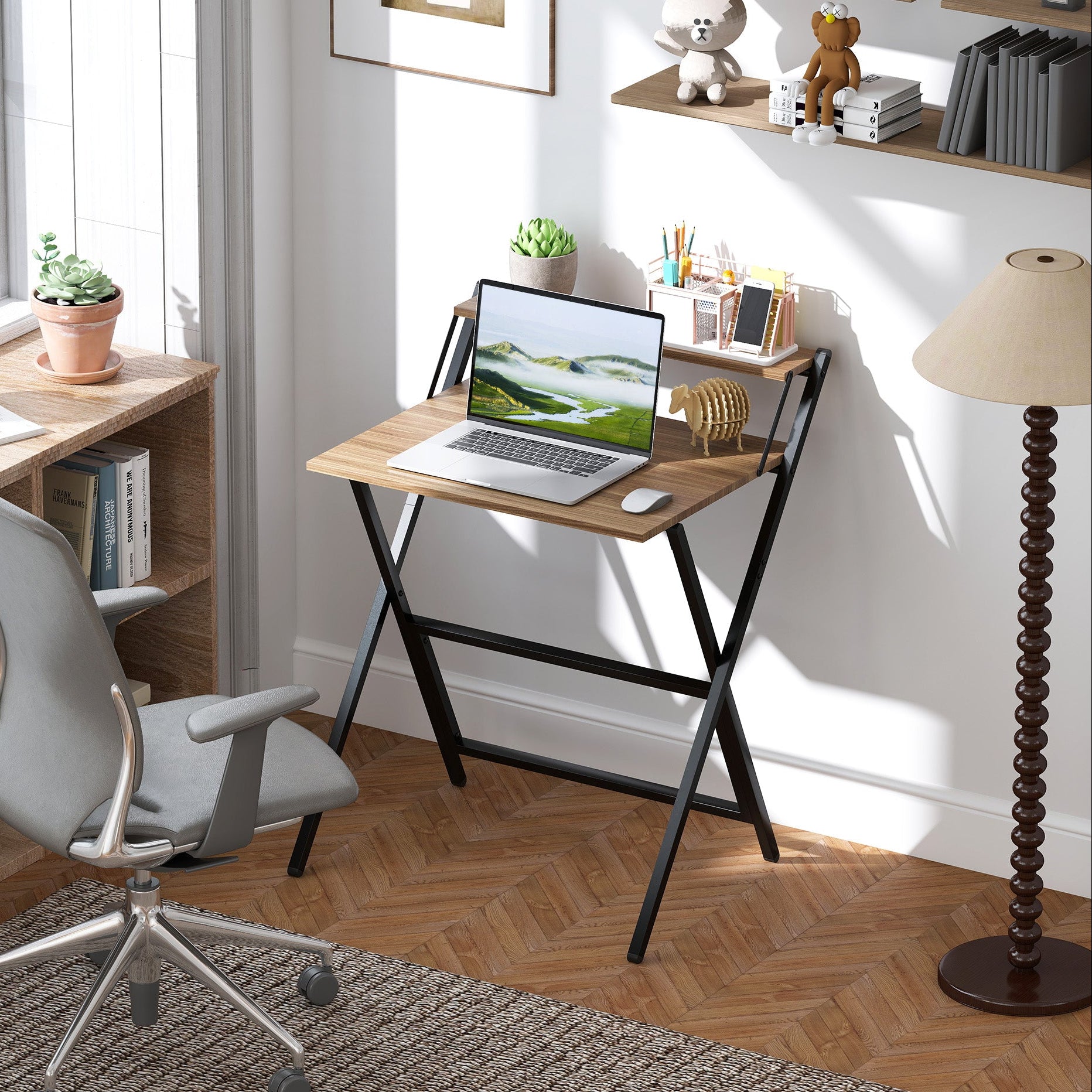 Home office with a wooden desk, chair, laptop, and decor items.