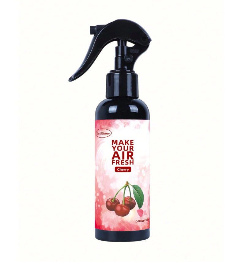 Air freshener spray bottle with cherry design on a white background