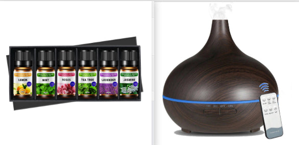 Aromatherapy diffuser set with essential oil bottles on a white background