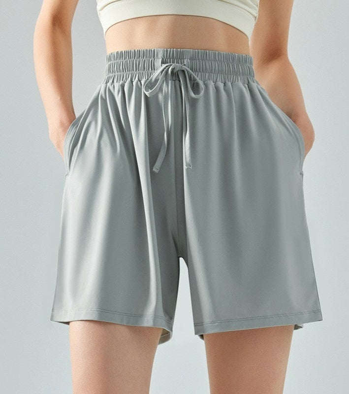 Gray shorts with a drawstring on a gray background