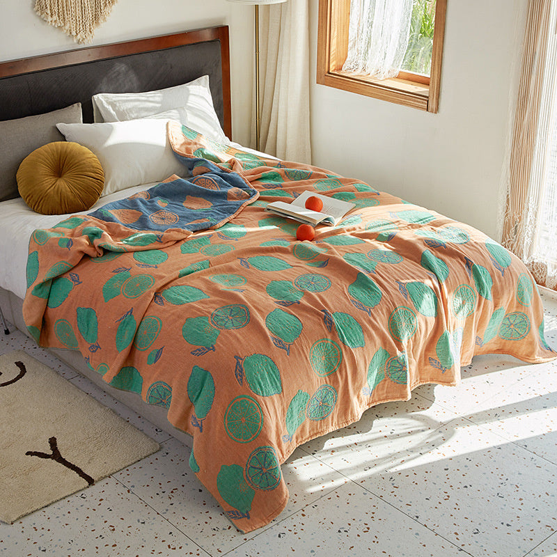 lemon Bed with a patterned quilt in a bright bedroom