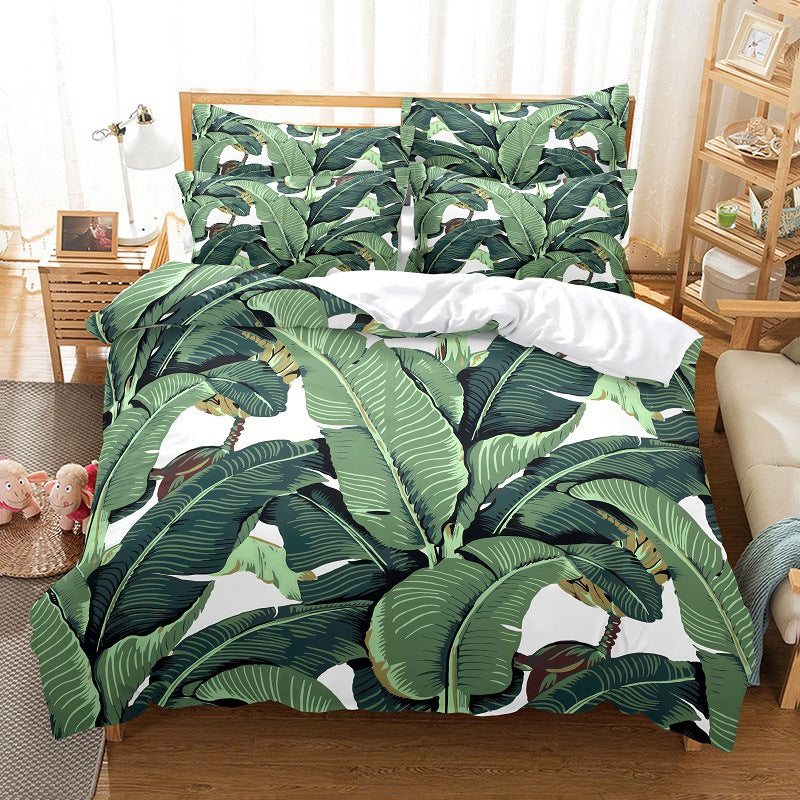 Bed with green leaf-patterned bedding in a room with wooden furniture and decor.