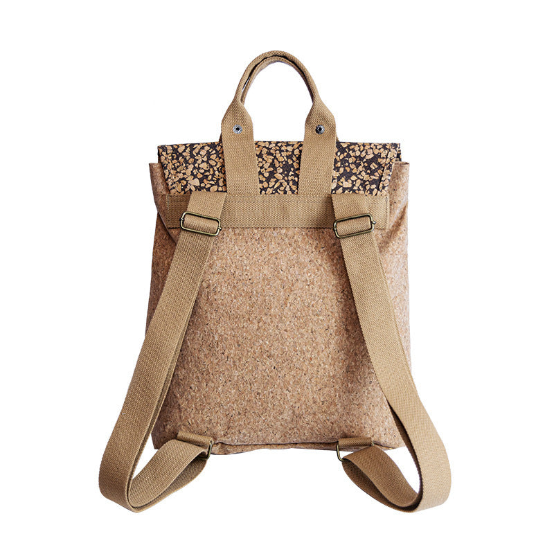 Beige cork backpack with floral patterned top on a white background