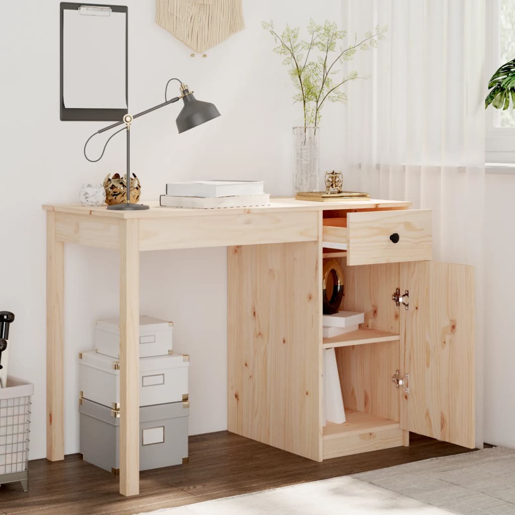Wooden desk with storage drawers and a lamp in a room setting.