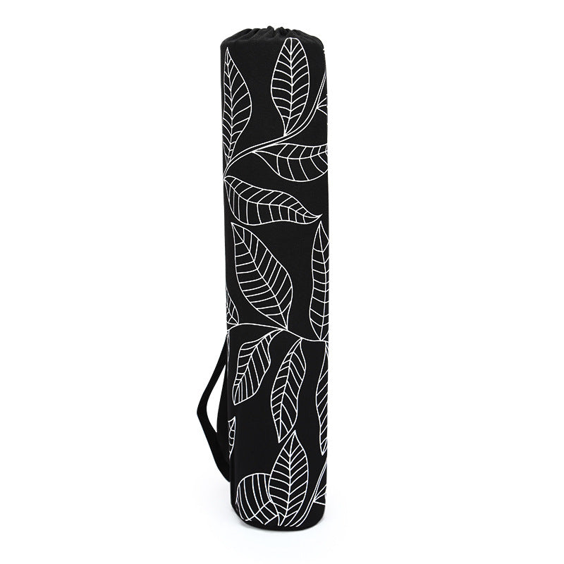 Black yoga mat bag with white leaf pattern on a white background