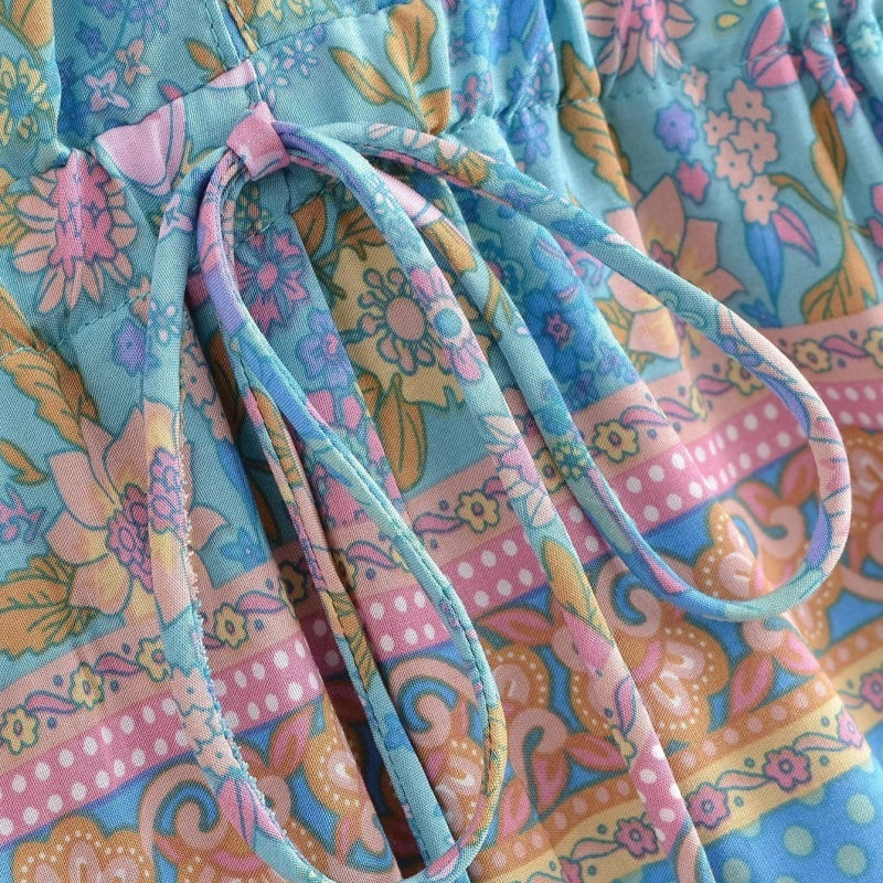 Colorful floral-patterned fabric with a tie, close-up view.