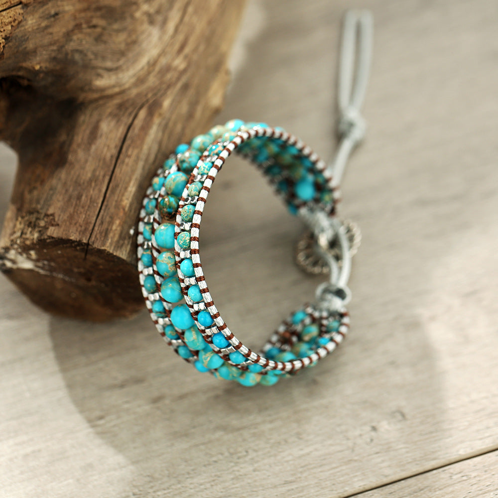Turquoise beaded bracelet on a wooden surface