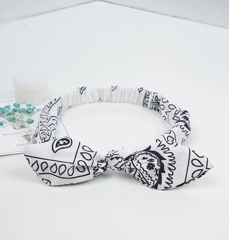 White headband with black pattern on a white background