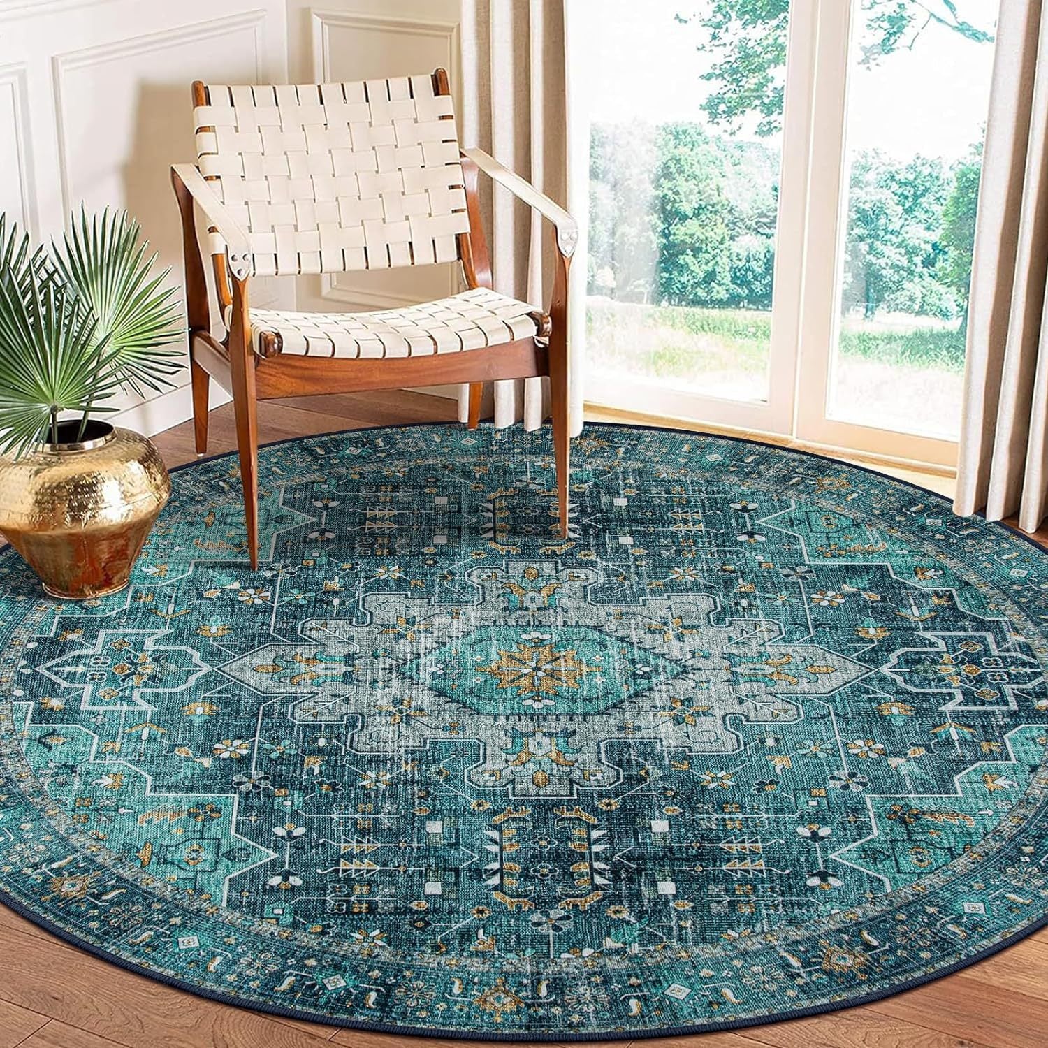 Teal patterned rug in a room with a wooden chair and decorative elements.