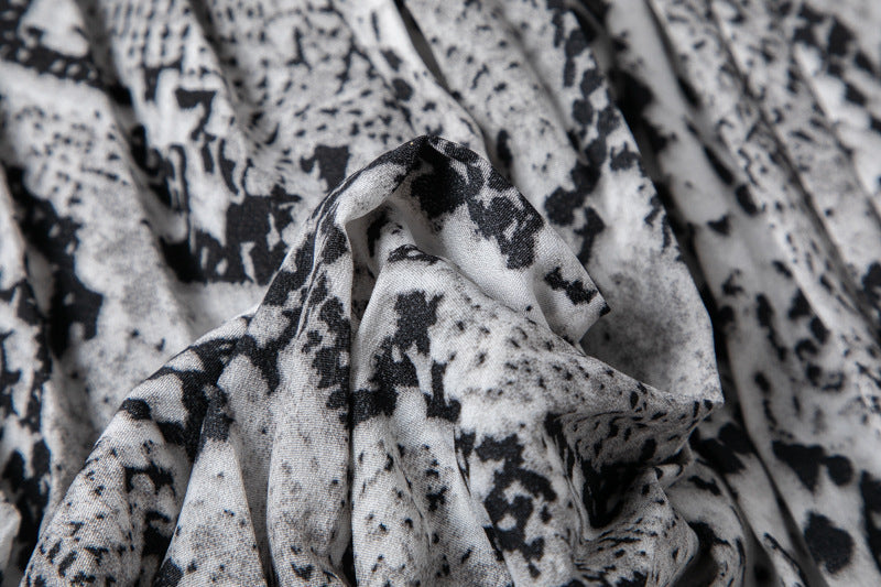 Close-up of textured fabric with black pattern