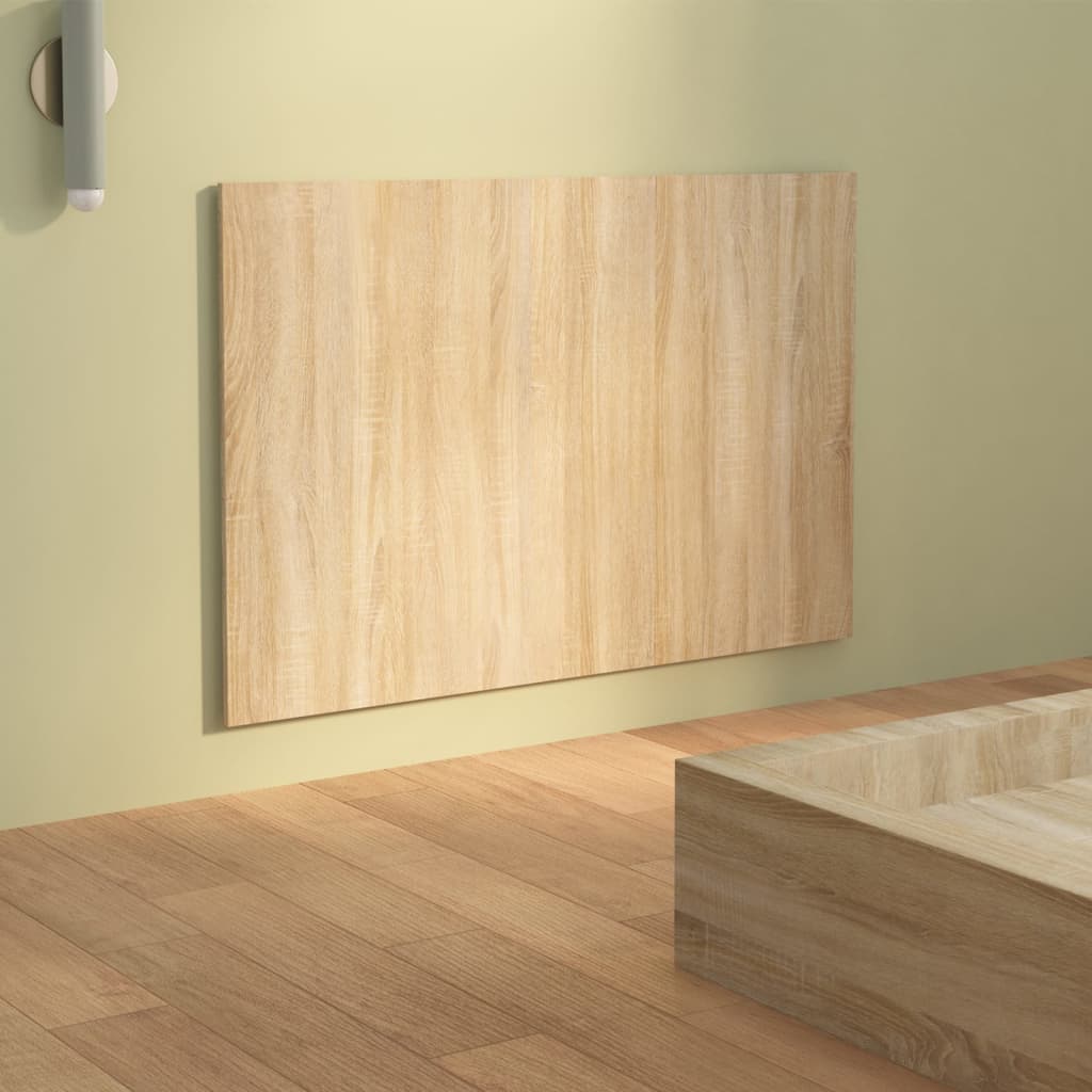 Wooden panel on a light green wall with a wooden floor.