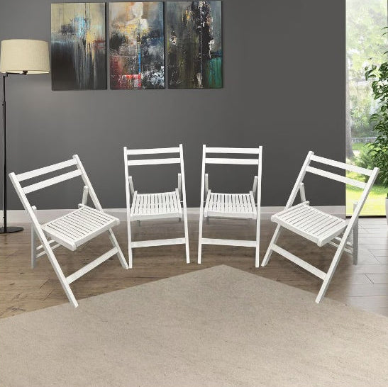Four white folding chairs in a room with abstract art on the wall.