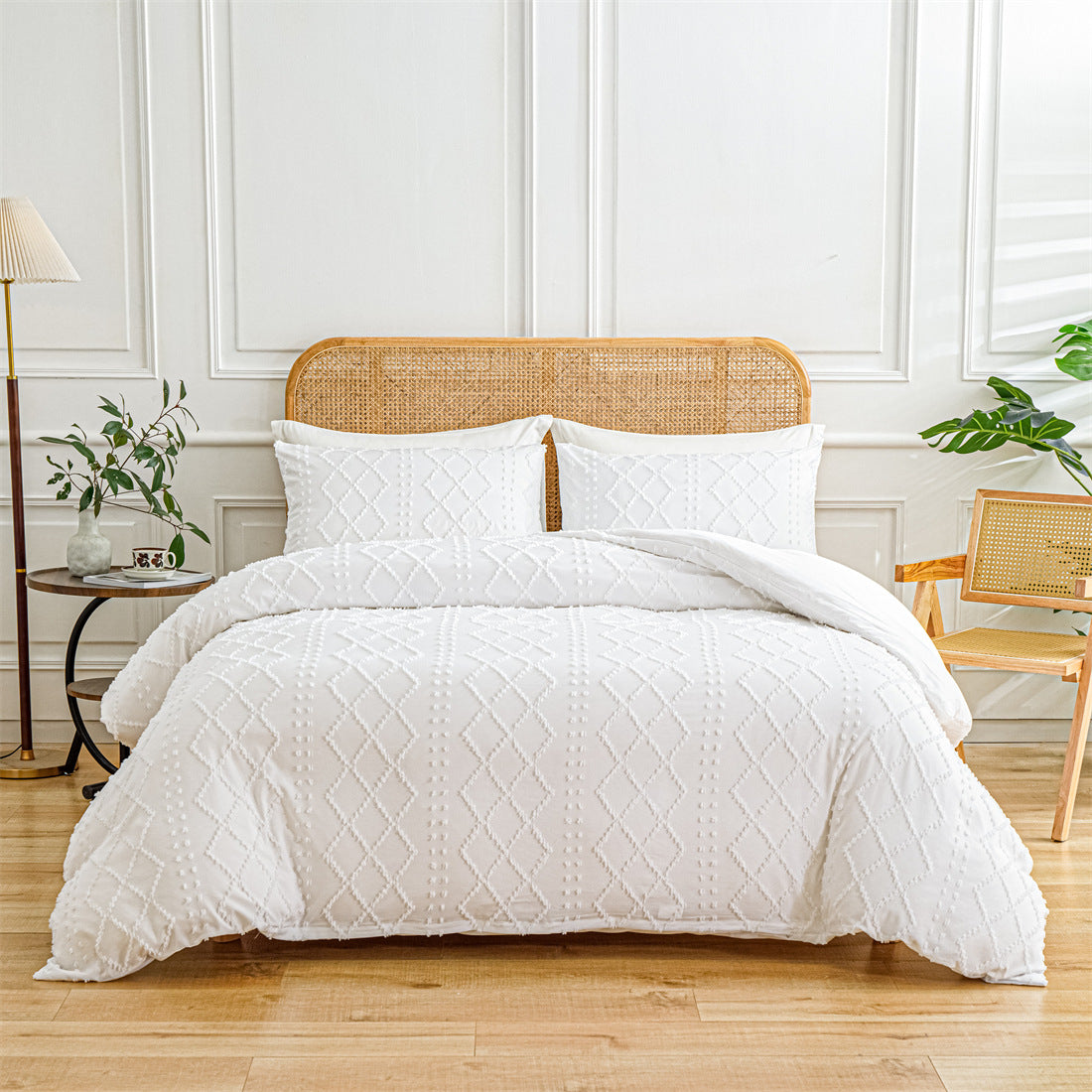 White quilted comforter set on a bed with a wooden headboard in a bright bedroom.