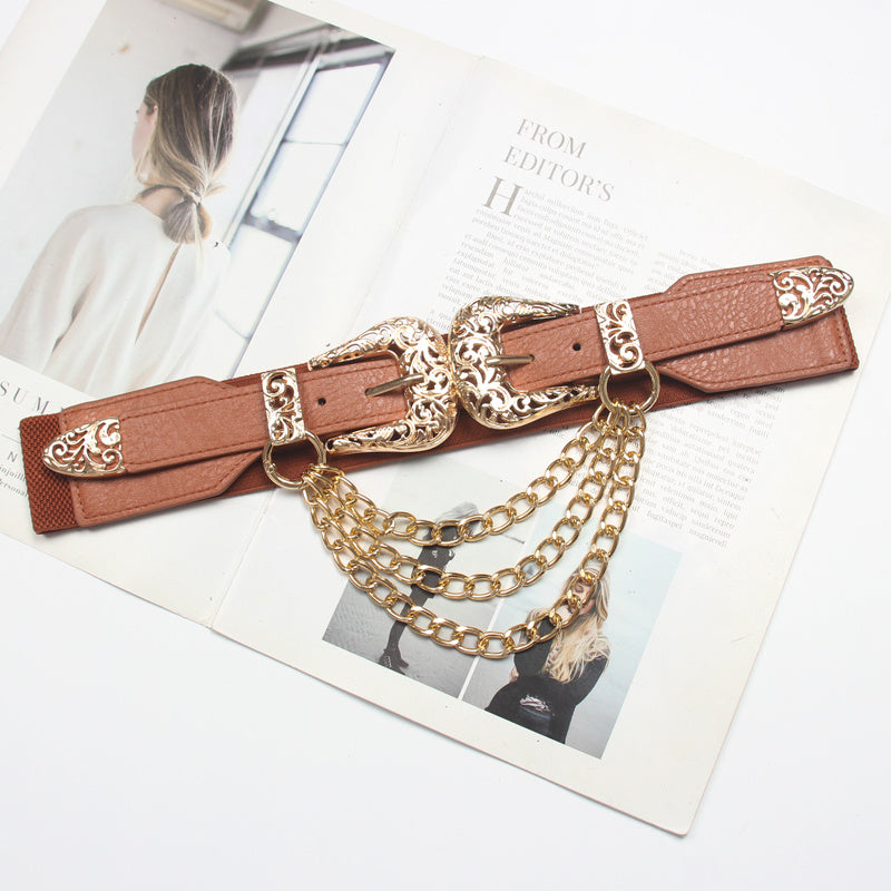 Brown belt with gold chain details on a magazine page