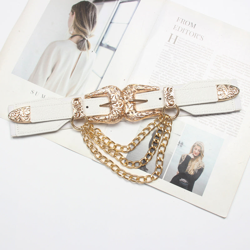 Gold belt with chain detail on a magazine