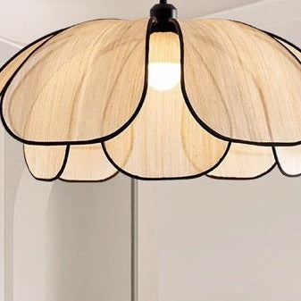 Decorative ceiling light fixture with a soft glow in a minimalistic room.