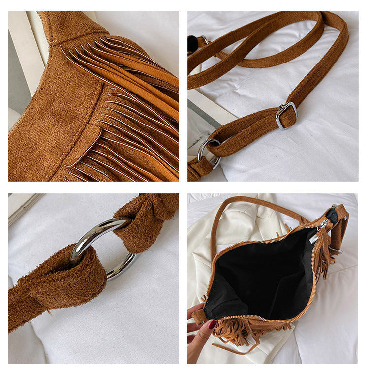 Brown suede handbag with fringe details on a white background