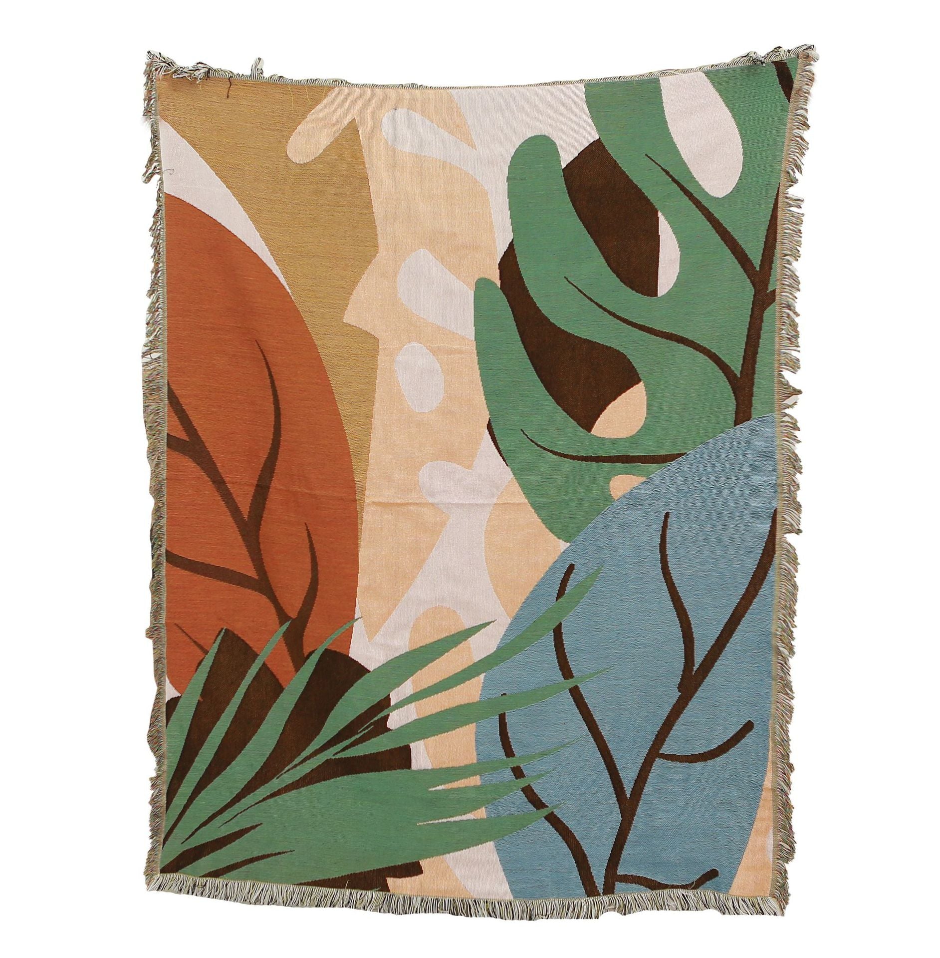 Decorative blanket with leaf pattern on a white background