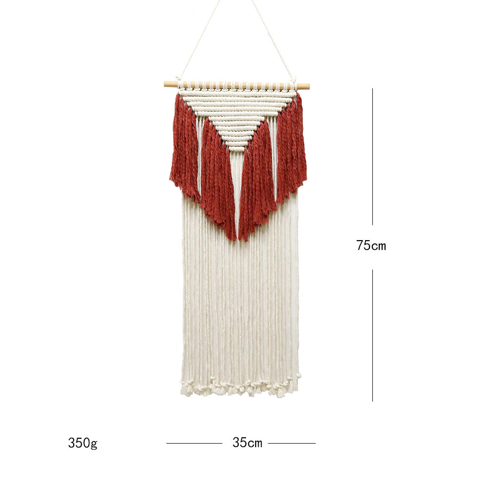 Woven wall hanging with red and white pattern on a white background