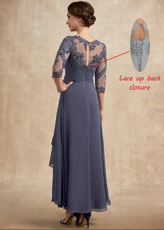 Woman wearing a long blue dress with lace detailing on a beige background