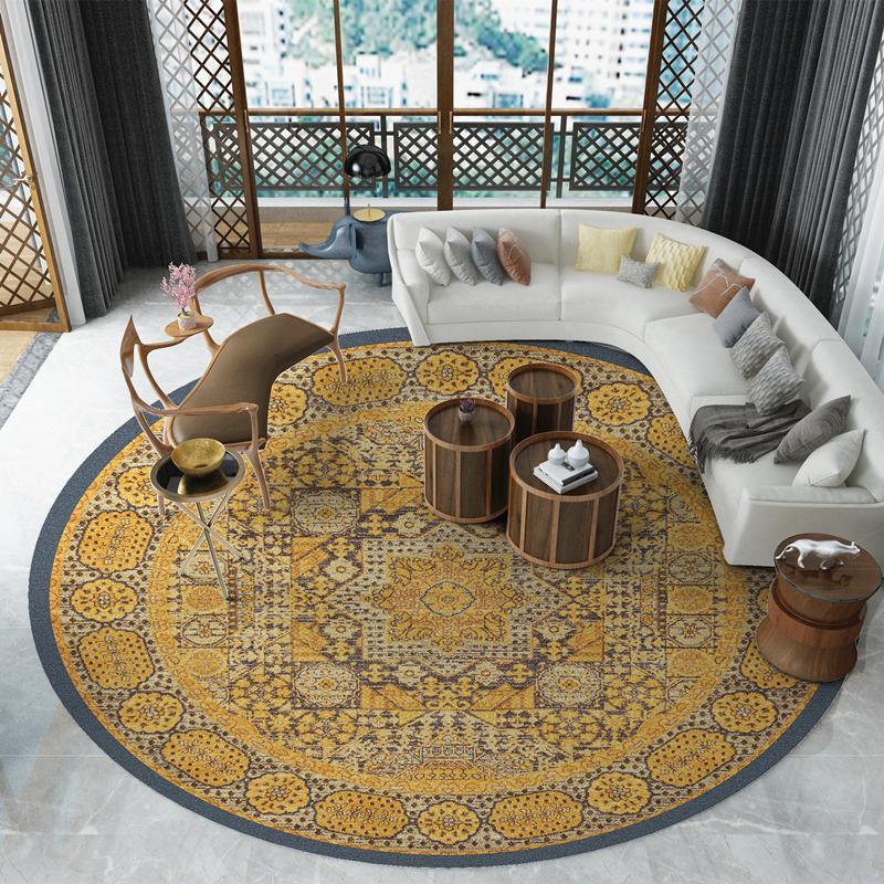 Round patterned rug in a living room with furniture and decor.