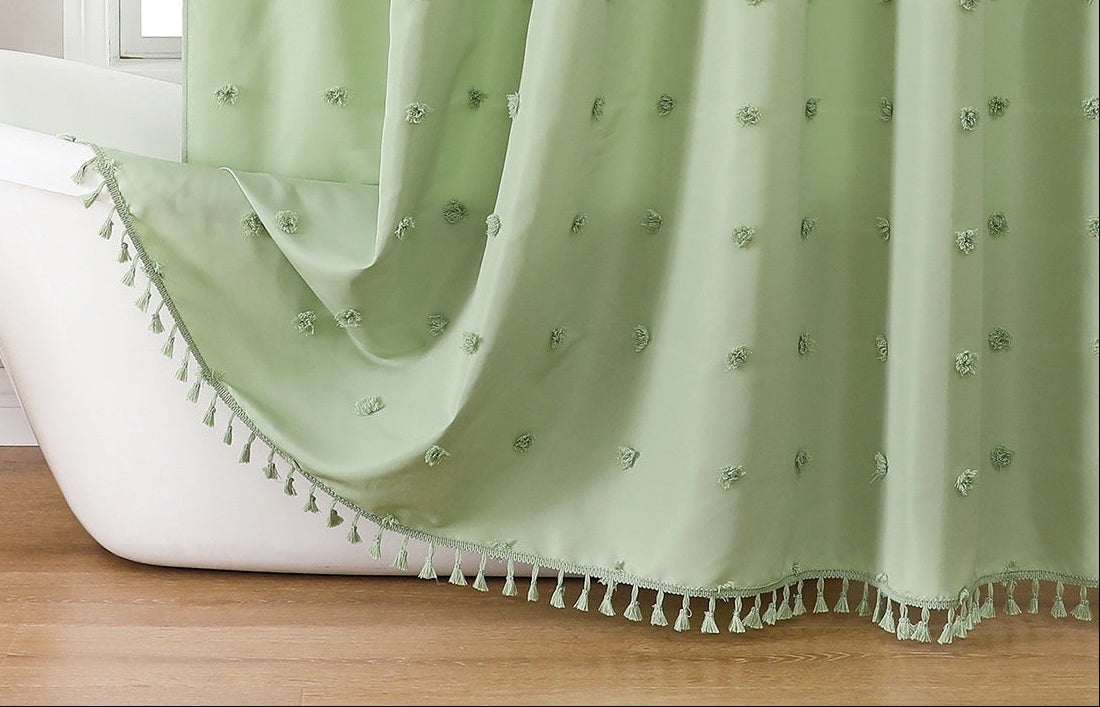 Green shower curtain with decorative elements in a bathroom setting