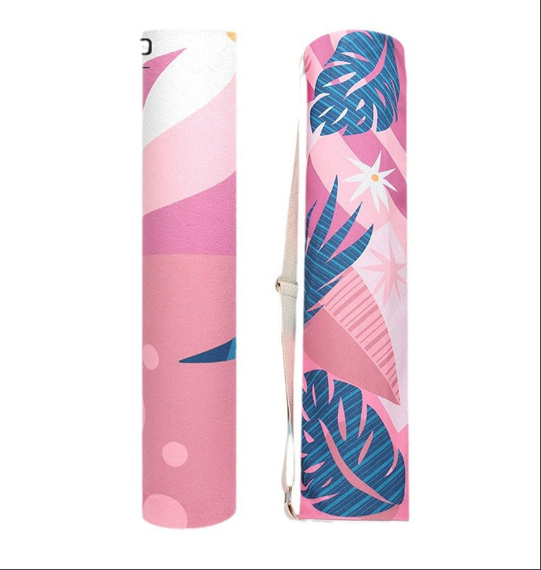 Pink yoga mat with tropical leaf design on a white background