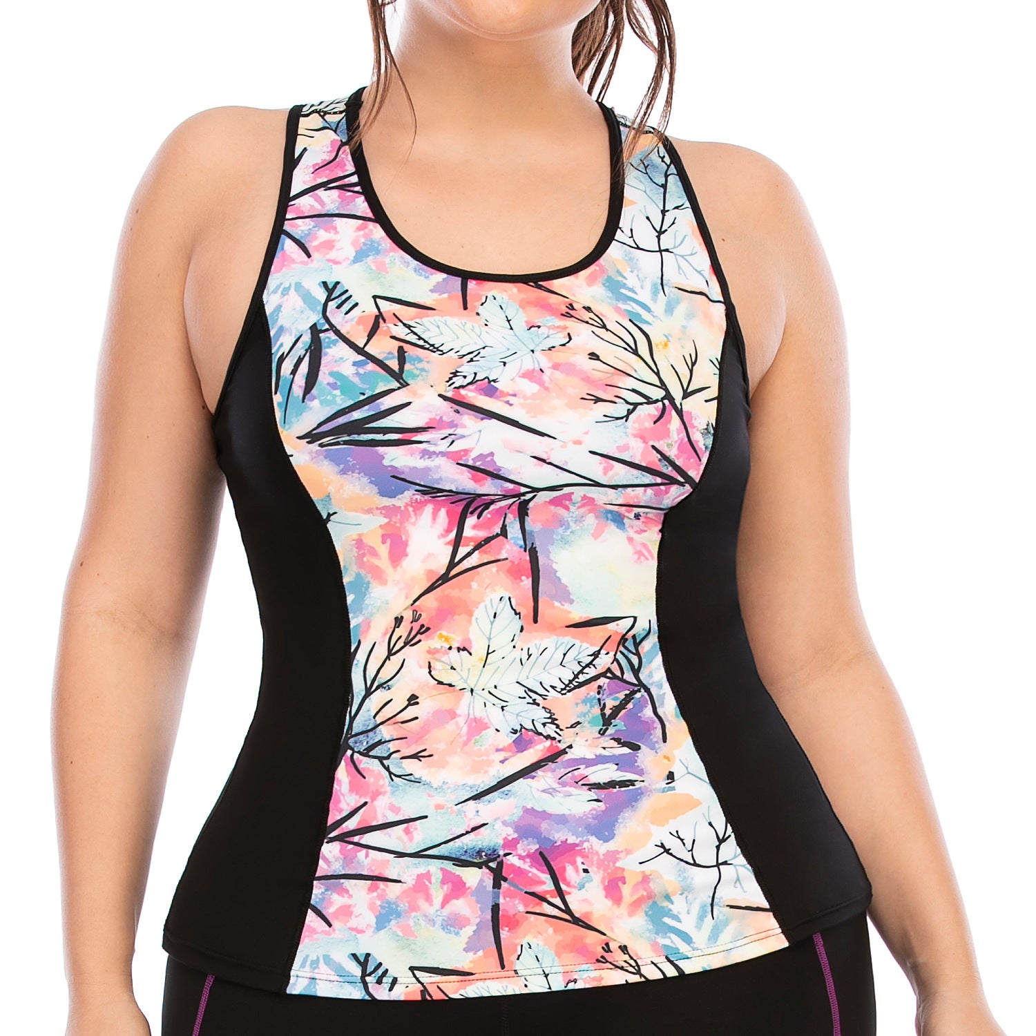 Woman wearing a colorful floral tank top with black sides on a white background