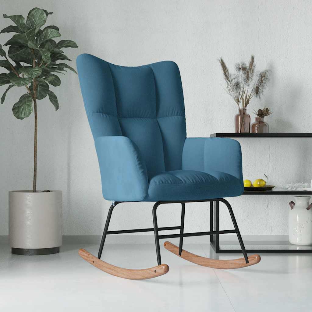 Blue rocking chair in a room with a plant and decorative items.