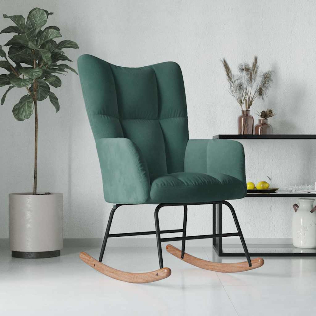 Green rocking chair in a room with a plant and decorative items.