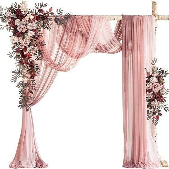Pink drapes with floral arrangements on a white background