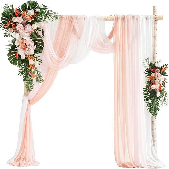 Decorative arch with pink curtains and floral arrangements on a white background