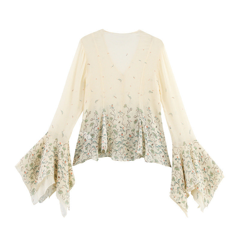 Floral patterned blouse with ruffled sleeves on a white background