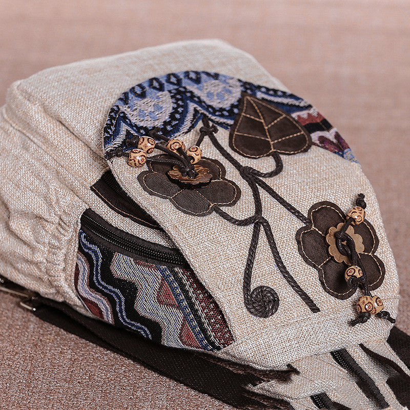 Embroidered fabric with floral patterns on a beige background