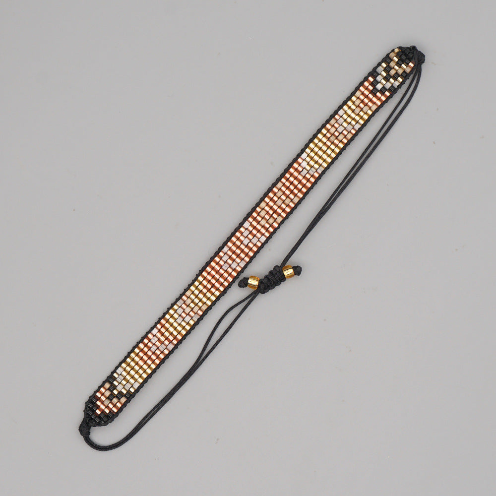Necklace with beaded design on a gray background