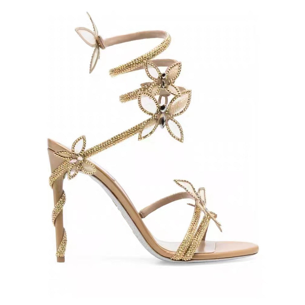 Gold embellished sandal on a white background