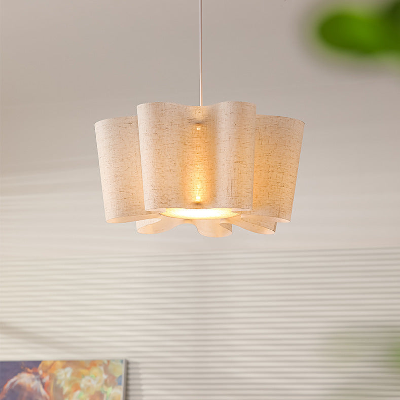 Ceiling light fixture with woven design on a neutral background