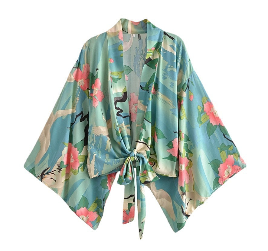 Floral patterned kimono-style jacket on a white background