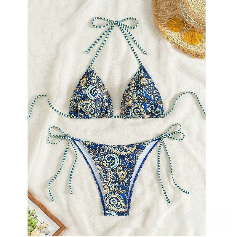 Blue paisley bikini set with matching hat on a white background