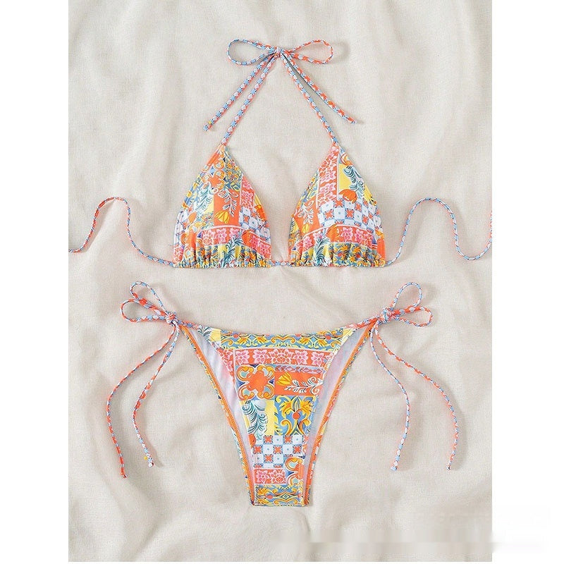 Colorful bikini set on a beige background