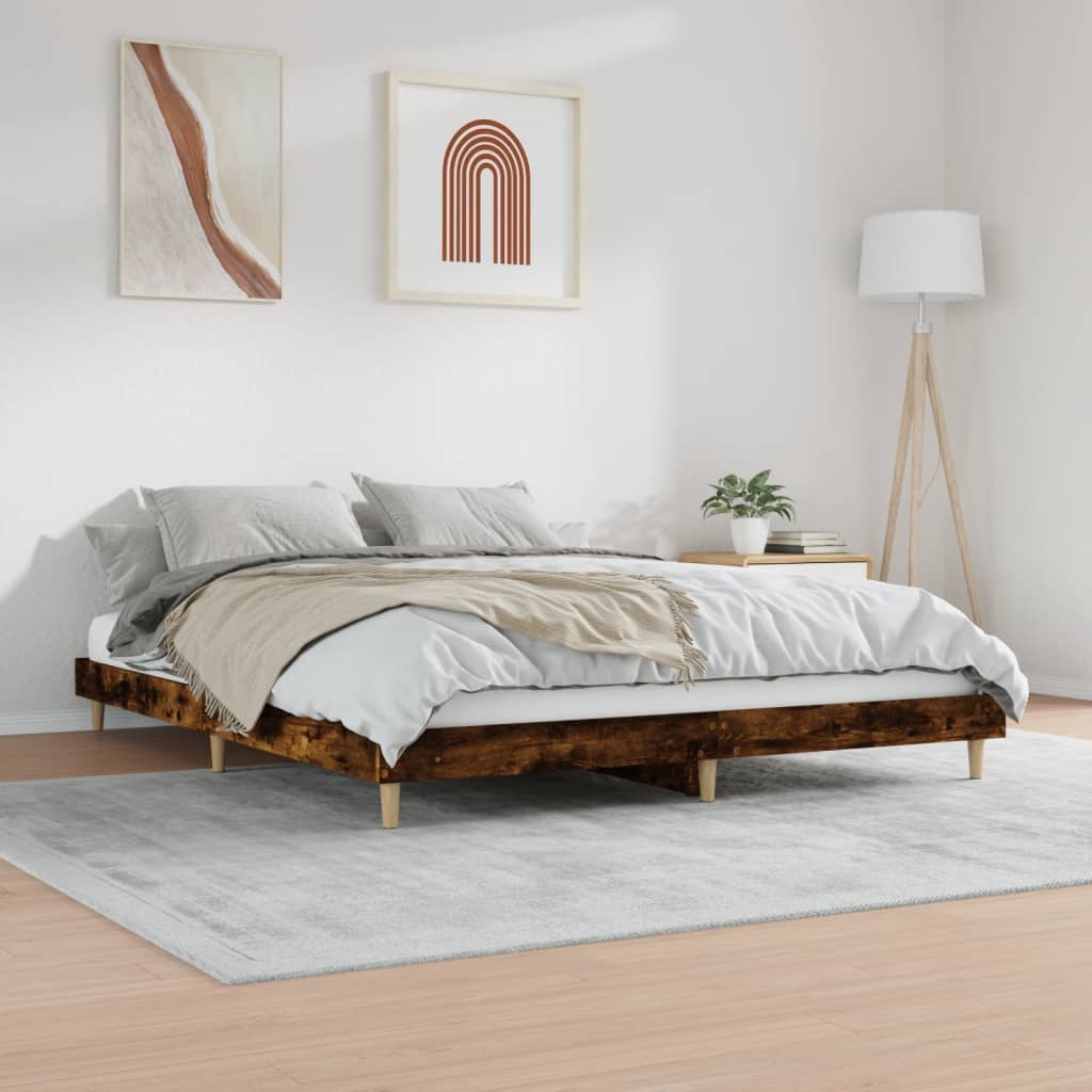 Bedroom with a wooden bed frame, white bedding, and decorative elements.