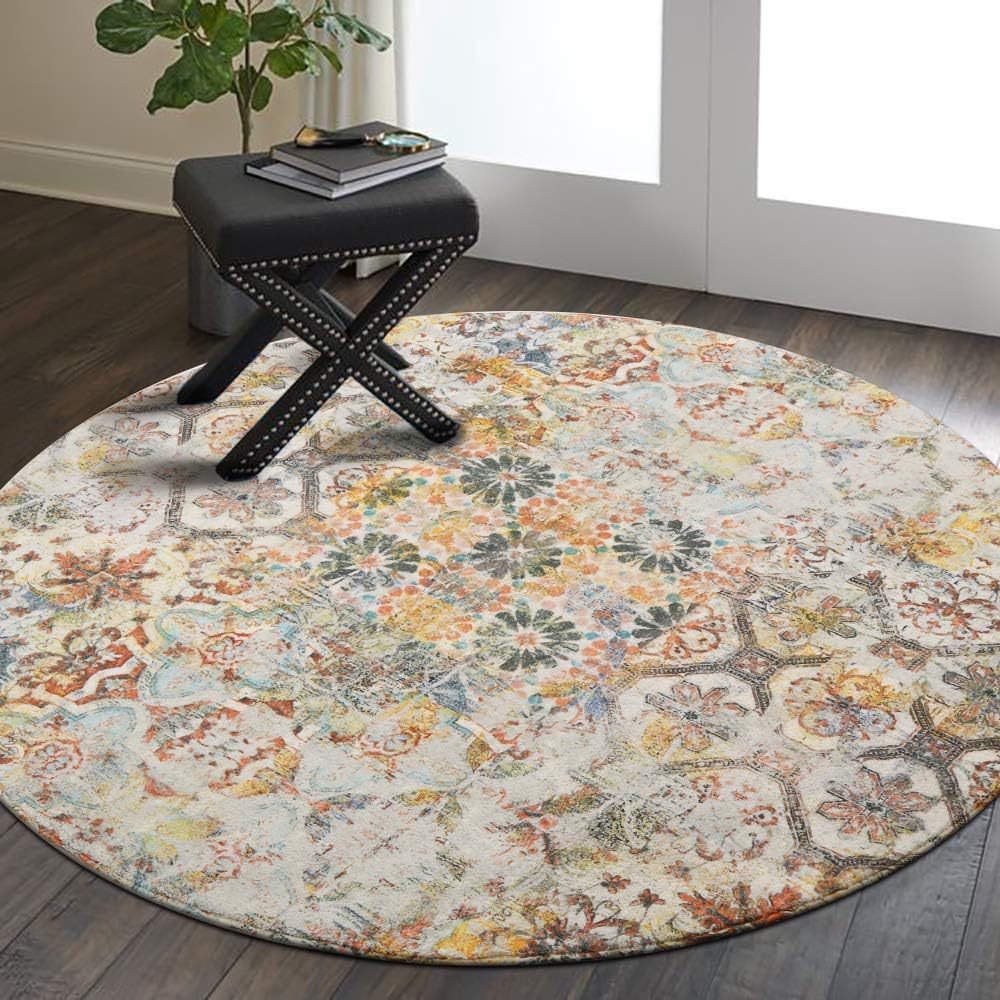 Round floral patterned rug on a wooden floor with a black stool.