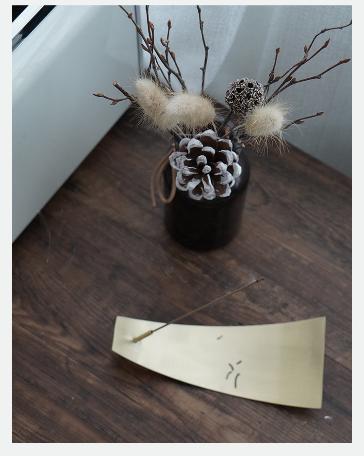 Decorative items on a wooden surface with a neutral background