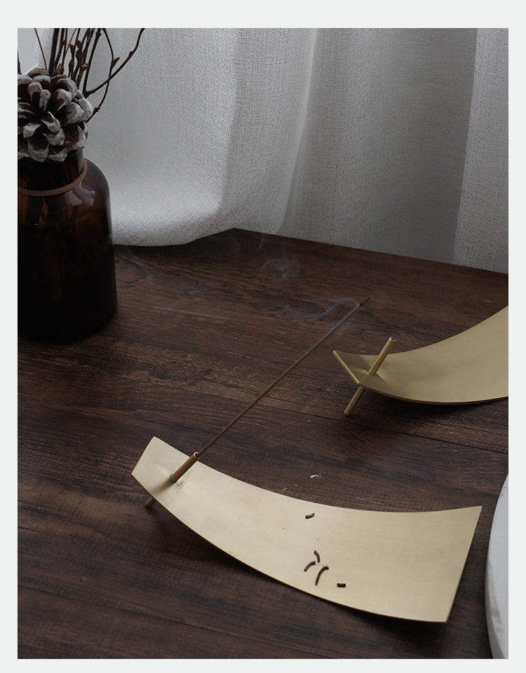 Decorative items on a wooden surface with a neutral background