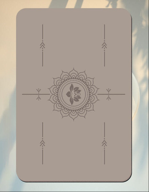 Decorative mat with a central mandala design on a blurred natural background