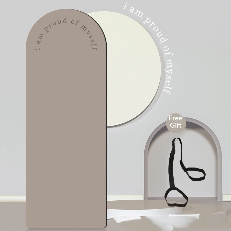 Decorative mirror with 'I am proud of myself' text and a free gift label on a light gray background.