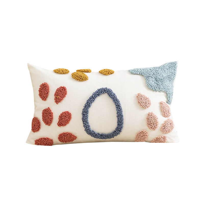 Decorative pillow with paw prints and a blue circle on a white background