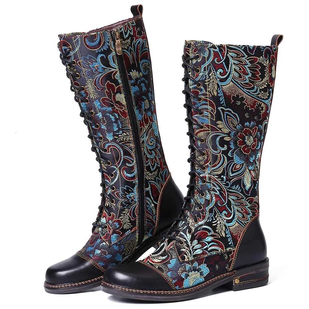 Pair of knee-high boots with floral pattern on a white background