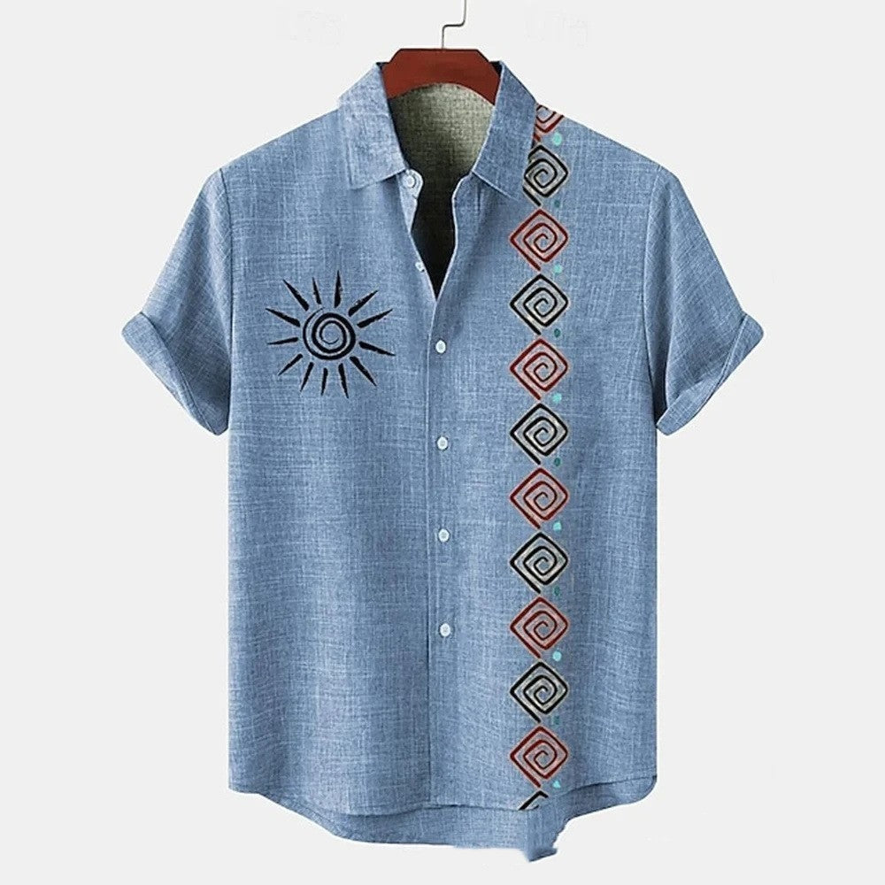Blue shirt with sun design and geometric patterns on a hanger against a white background